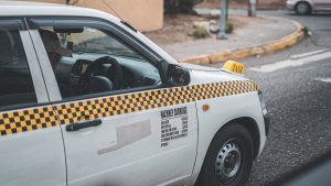 White Jamaican red plate taxi