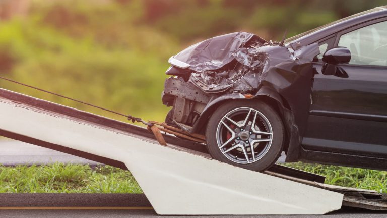 front-black-car-get-damaged-by-accident-road