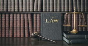 low-key-filter-law-bookshelf-with-wooden-judge-s-gavel-golden-scale
